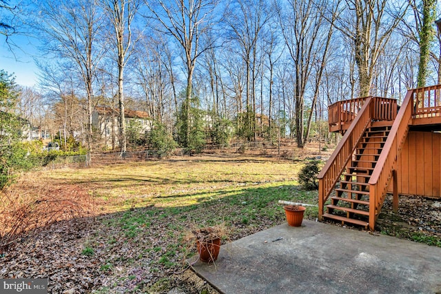 view of yard featuring a wooden deck