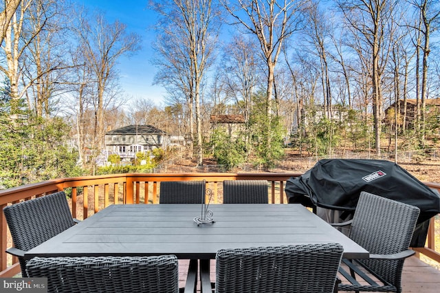 wooden terrace with a grill