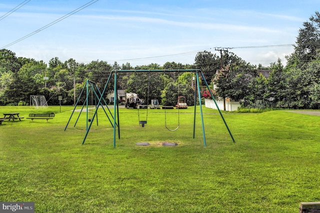 view of playground with a yard