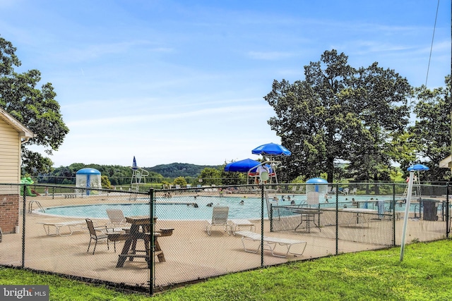 view of swimming pool with a patio