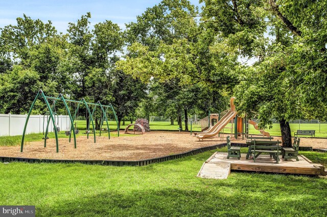 view of jungle gym with a lawn