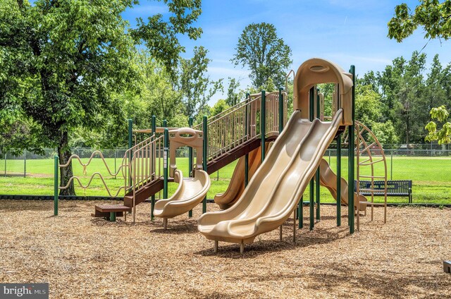 view of jungle gym with a lawn