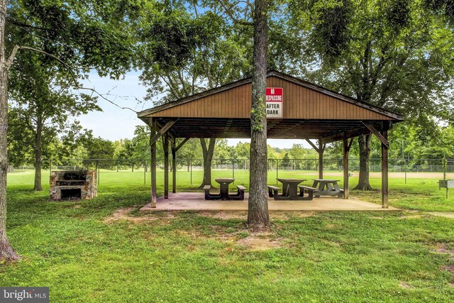 view of community with a patio area, a gazebo, and a yard