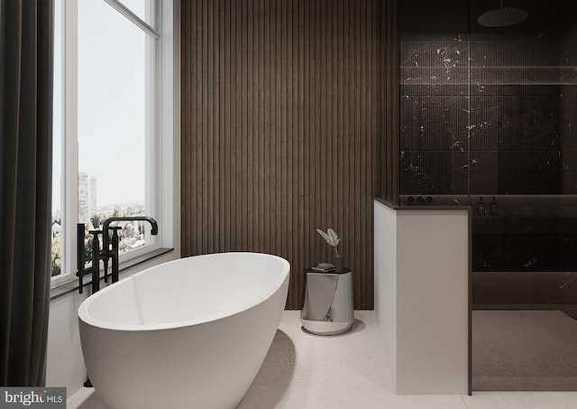 bathroom with tile flooring and a washtub