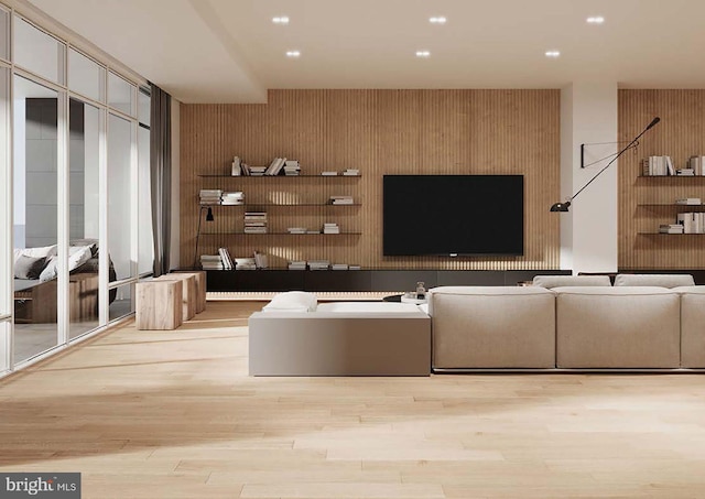 unfurnished living room featuring wood walls and light hardwood / wood-style flooring