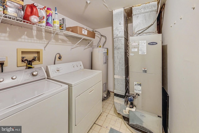 laundry area with heating unit, washing machine and dryer, and electric water heater