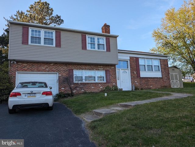 split level home featuring a garage and a front lawn