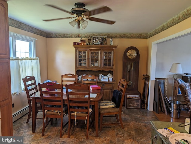 tiled dining area featuring ceiling fan and a baseboard radiator