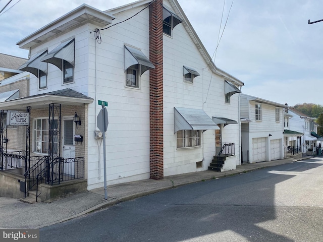 view of side of property featuring a garage