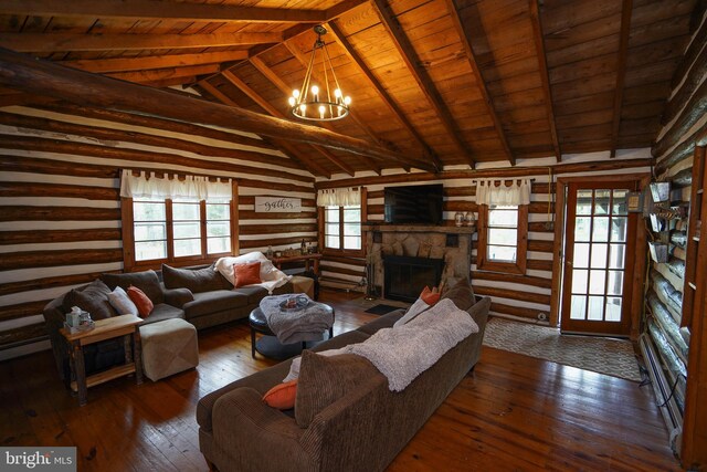 living room featuring a stone fireplace, vaulted ceiling with beams, a chandelier, dark wood-type flooring, and wooden ceiling