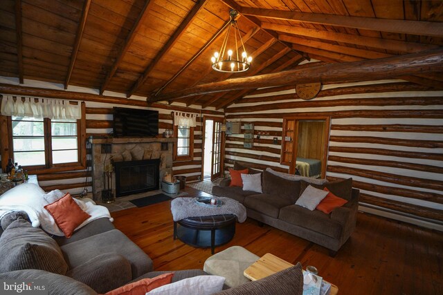 living room with vaulted ceiling with beams, hardwood / wood-style floors, wooden ceiling, and a fireplace