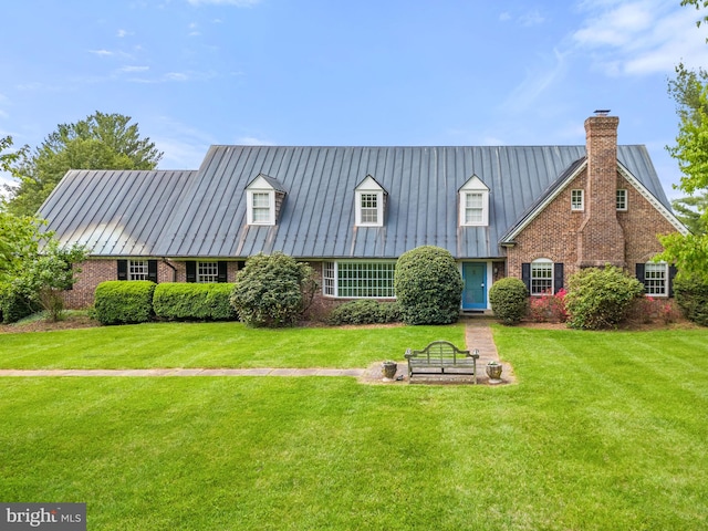 rear view of house featuring a lawn