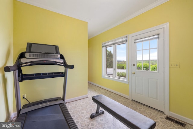 exercise room with ornamental molding