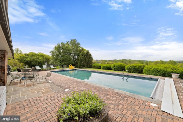 view of pool featuring a patio area