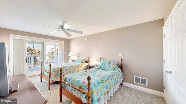 bedroom featuring access to exterior, ceiling fan, and light carpet