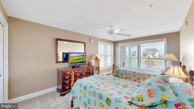 bedroom with access to exterior, light carpet, and ceiling fan