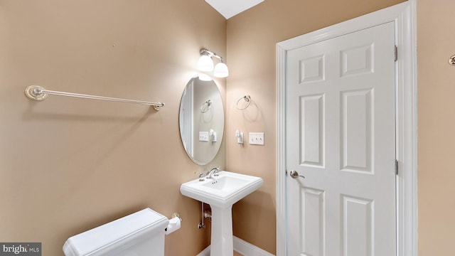 bathroom with sink and toilet