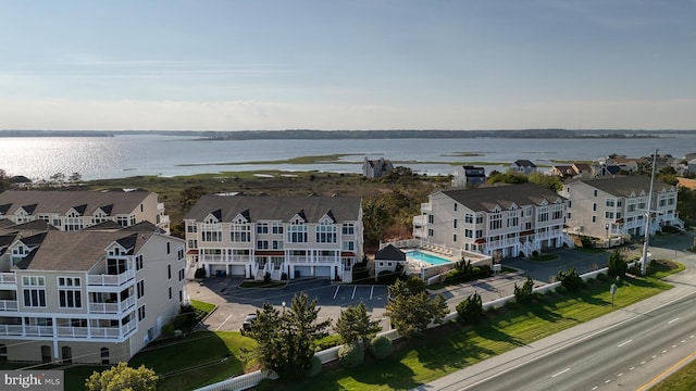 birds eye view of property featuring a water view