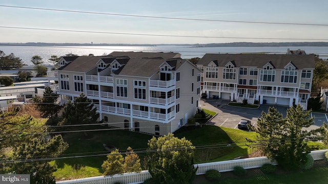 birds eye view of property featuring a water view