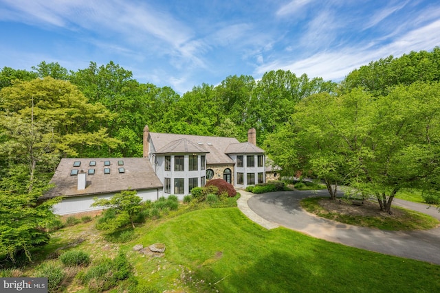 view of front of home with a front lawn