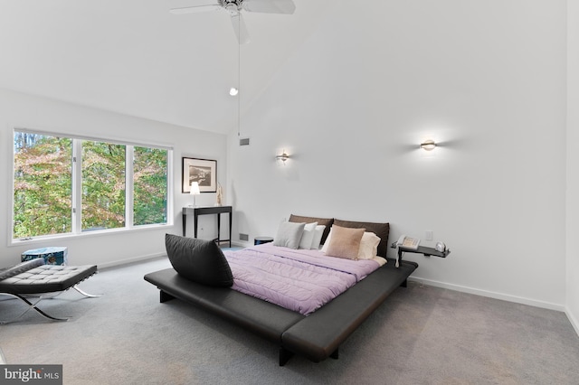 carpeted bedroom with high vaulted ceiling and ceiling fan