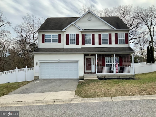 view of front of home with a garage, a porch, and a front lawn