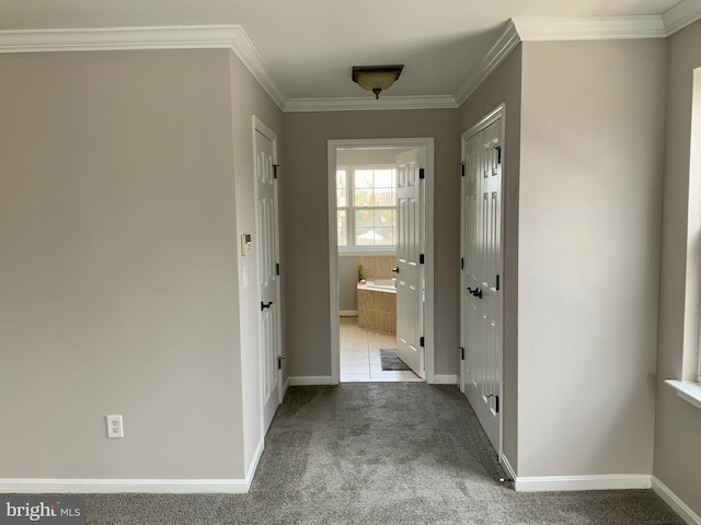 hall featuring light carpet and crown molding