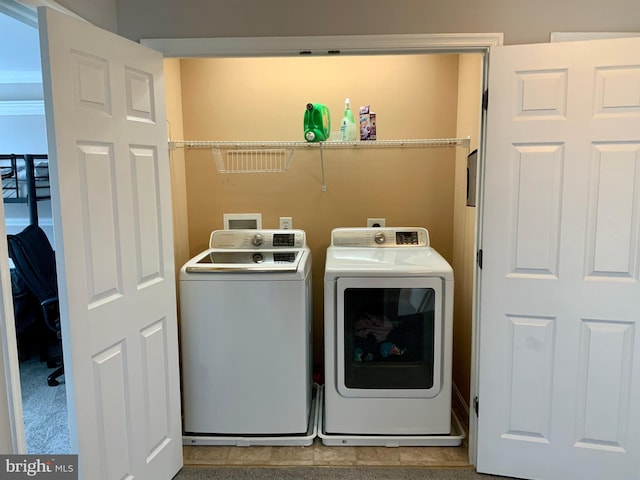 washroom with washer and dryer