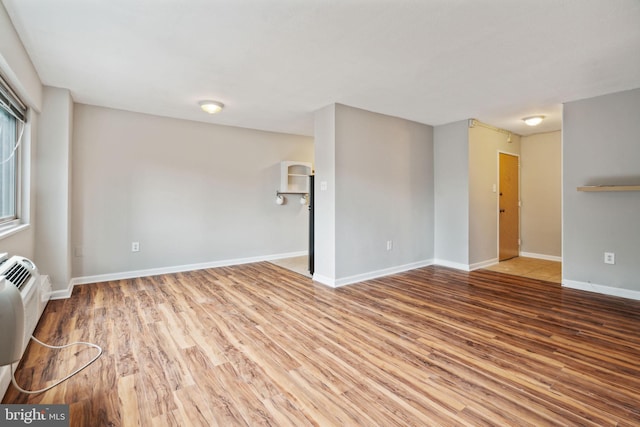 empty room featuring wood-type flooring