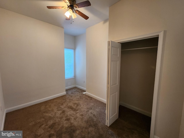 unfurnished bedroom featuring a closet, ceiling fan, and dark carpet