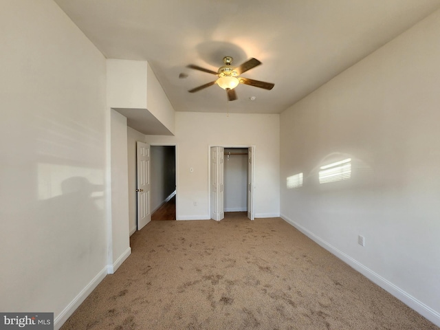 unfurnished bedroom featuring a closet, ceiling fan, and carpet flooring