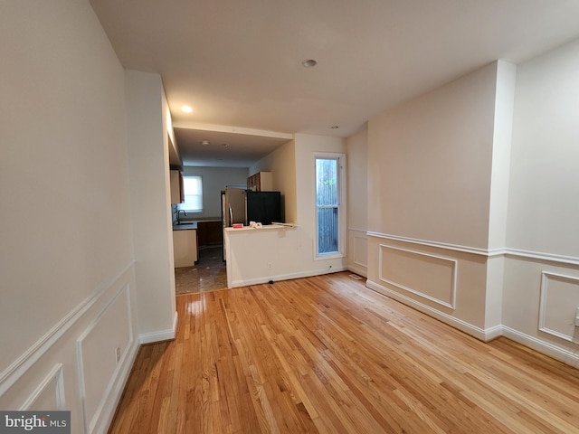 hallway with light wood-type flooring