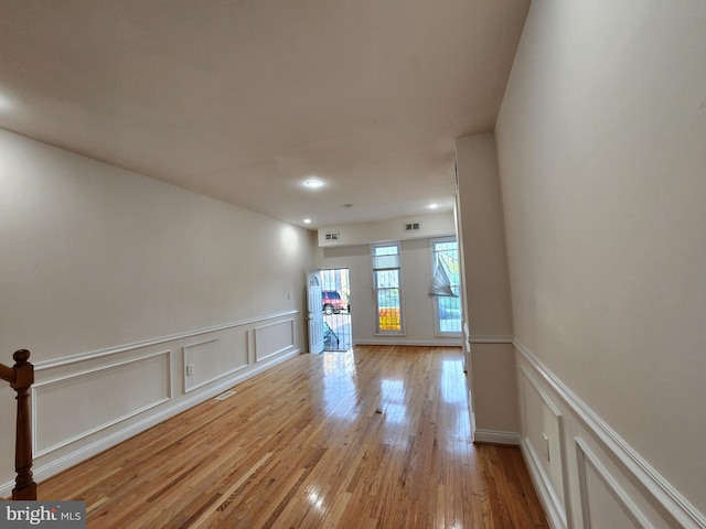 spare room with light wood-type flooring