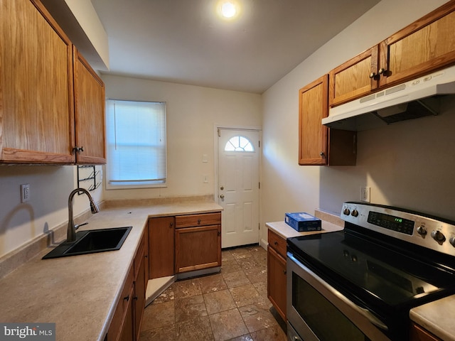 kitchen with sink, stainless steel electric range, and tile flooring