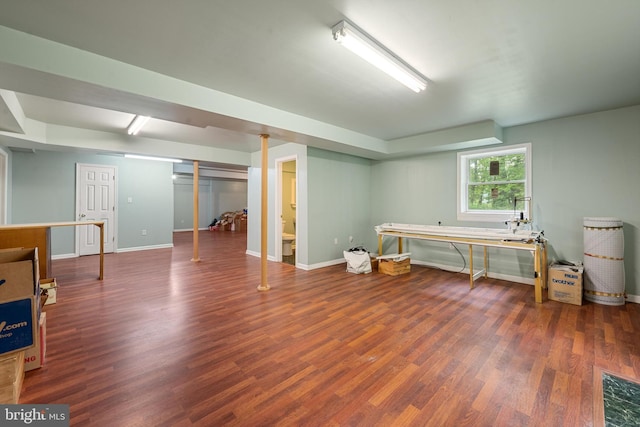 basement featuring dark wood-type flooring