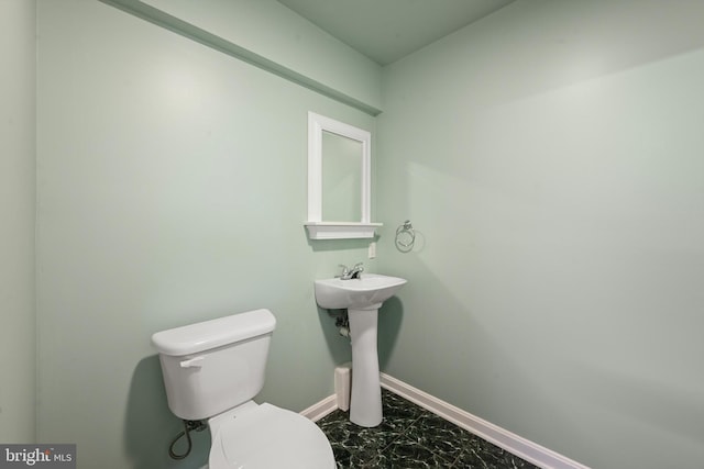 bathroom featuring toilet