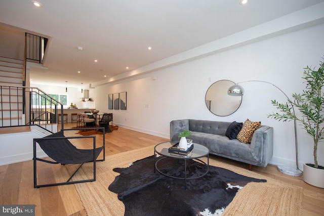 living room with light hardwood / wood-style flooring