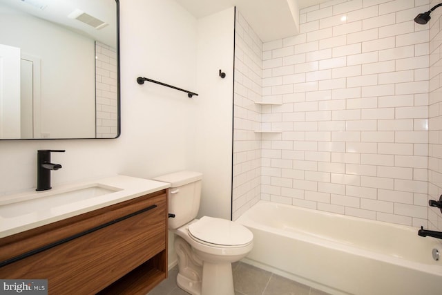 full bathroom with toilet, tiled shower / bath combo, tile patterned floors, and vanity