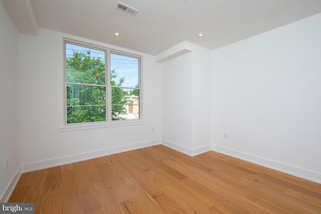 empty room with light wood-type flooring