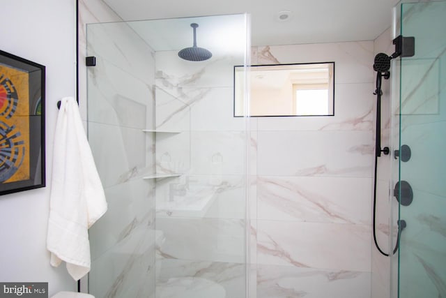 bathroom featuring an enclosed shower