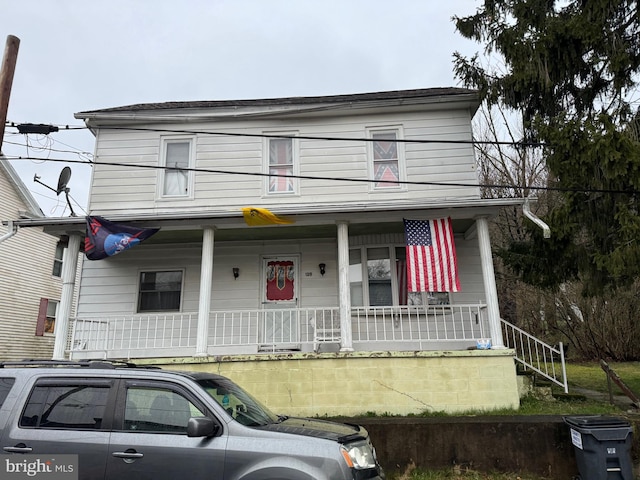 farmhouse featuring covered porch