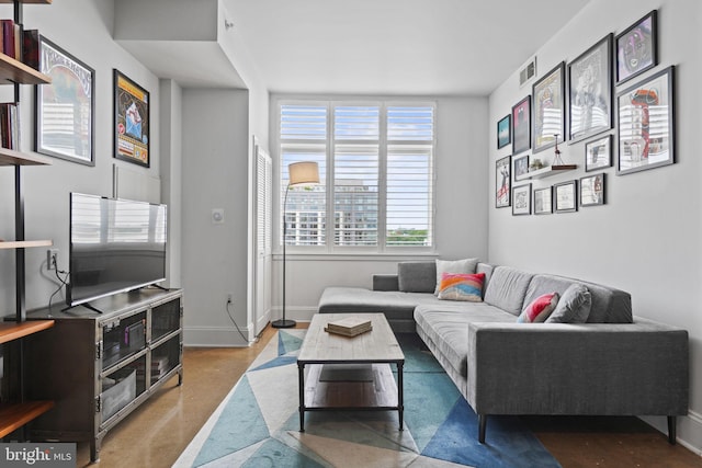 living room with visible vents and baseboards