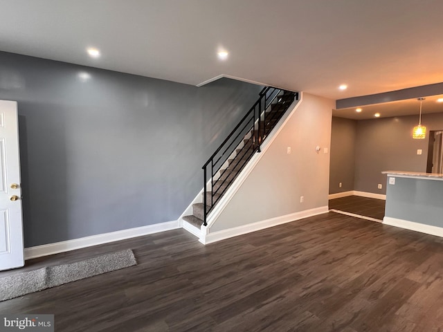 spare room featuring dark hardwood / wood-style flooring