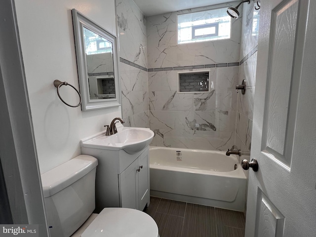 full bathroom with a healthy amount of sunlight, vanity, and toilet