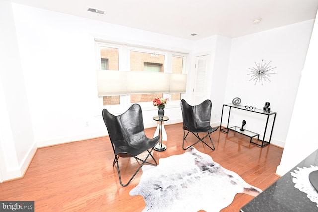 sitting room with light wood-type flooring