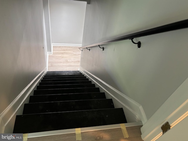 staircase featuring hardwood / wood-style flooring