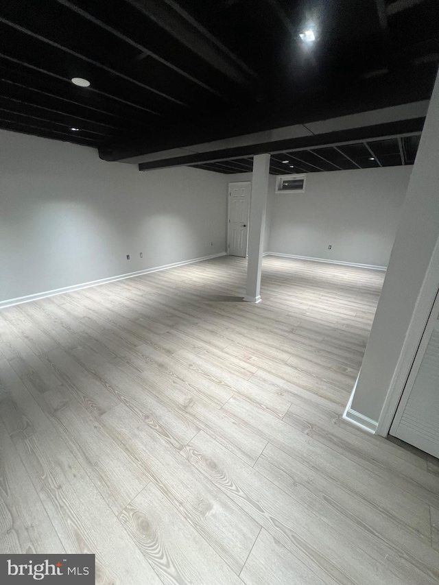 basement with light wood-type flooring