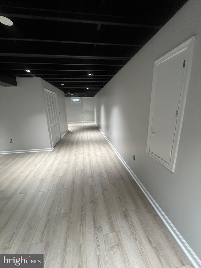 corridor featuring light hardwood / wood-style floors