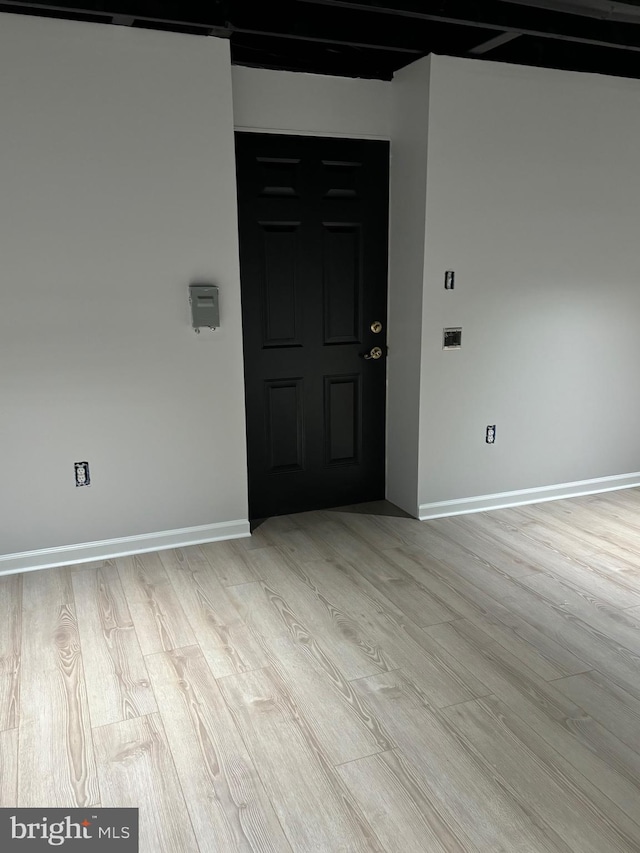 spare room with light hardwood / wood-style flooring