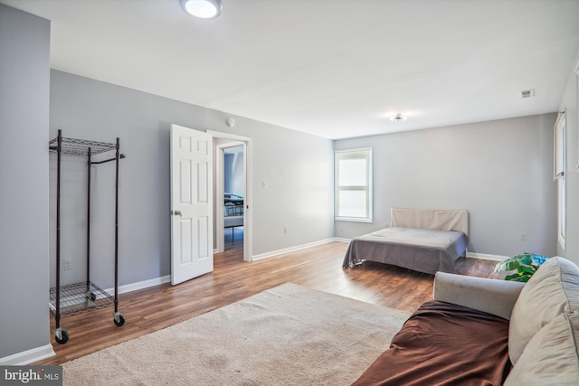 bedroom with light hardwood / wood-style floors